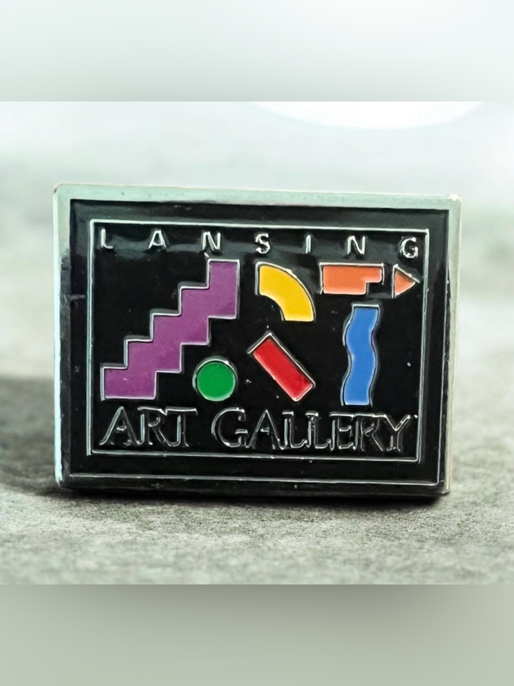 Source Unknown Lansing Art Gallery Enamel Pin - Black with Multi-Color Accents